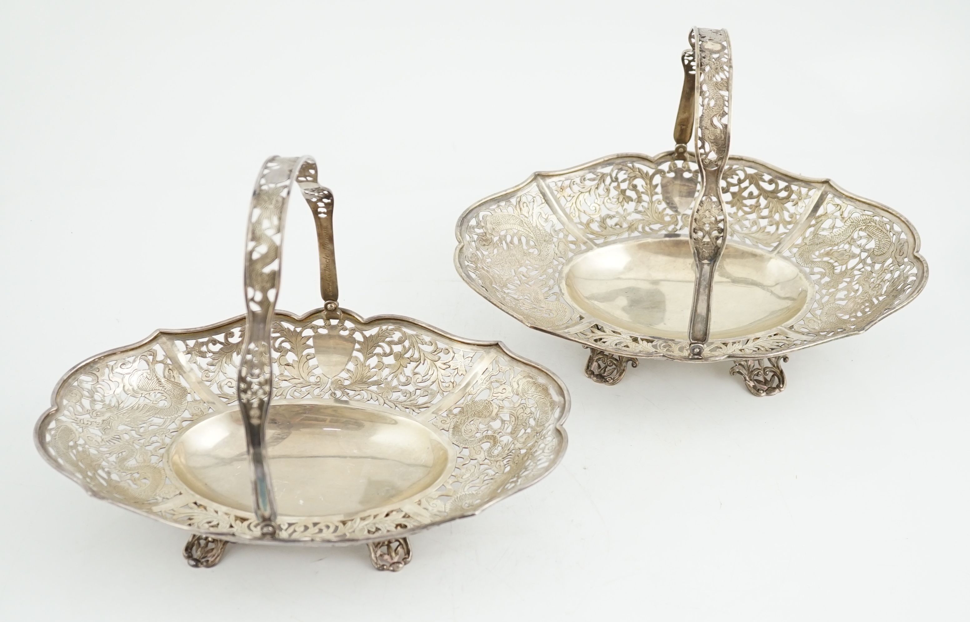 A pair of early 20th century Chinese Export pierced silver cake baskets, by Wang Hing, Hong Kong